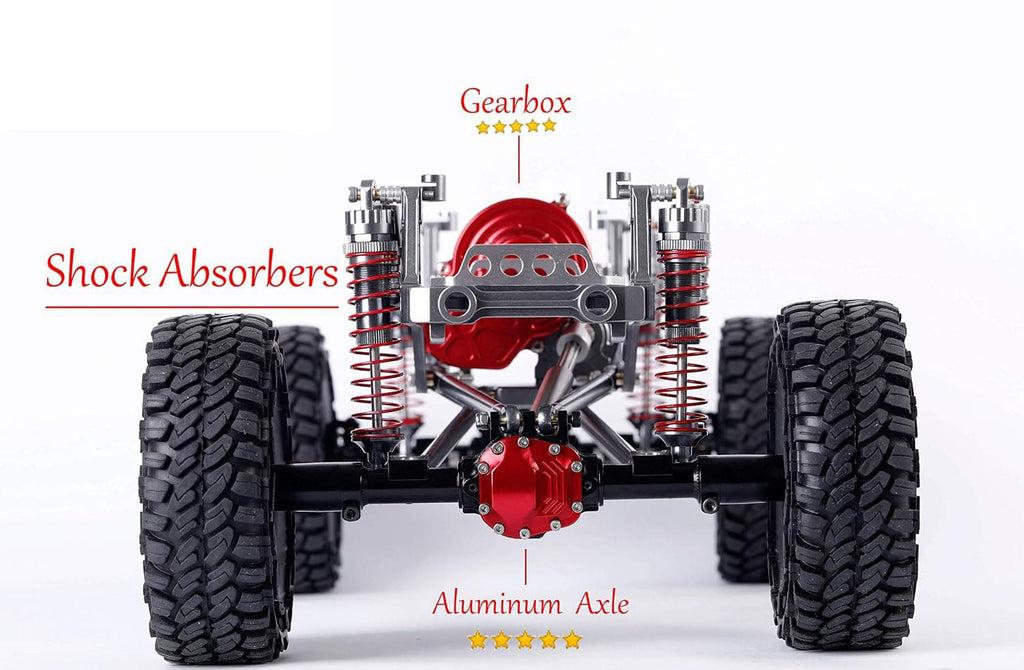 Front suspension and drivetrain of an off-road RC crawler or small vehicle, shown on a white background with red callout labels pointing to Gearbox, Shock Absorbers, and Aluminum Axle.