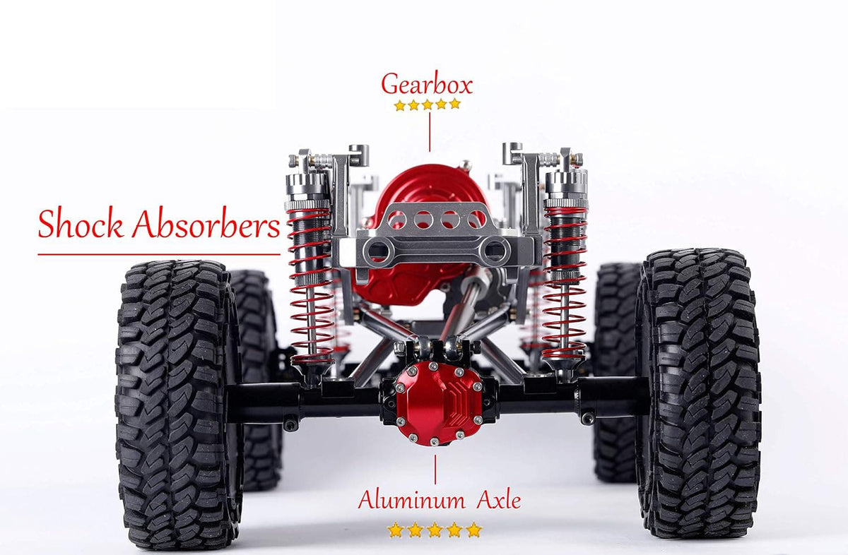 Front suspension and drivetrain of an off-road RC crawler or small vehicle, shown on a white background with red callout labels pointing to Gearbox, Shock Absorbers, and Aluminum Axle.